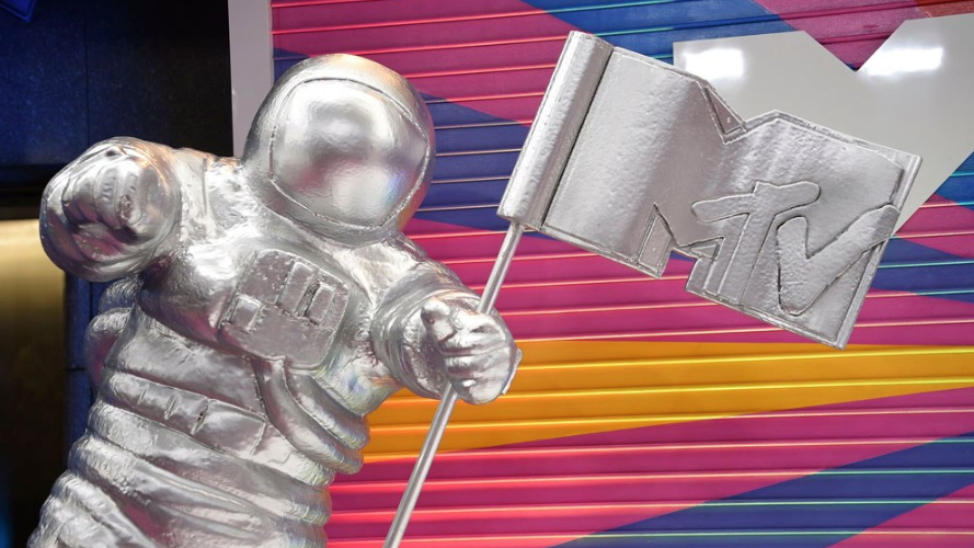 Spaceman holding a MTV flag