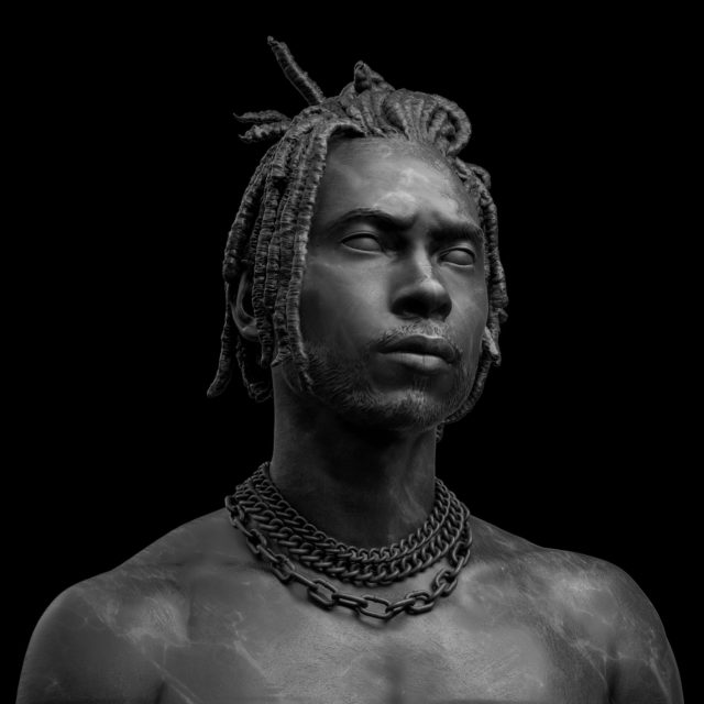 Black and grey image of Miguel as a statue